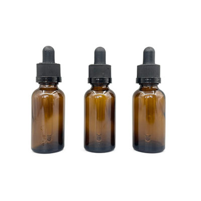 El cosmético de cristal ambarino 30ml embotella el aceite esencial con el dropper del cierre del trinquete