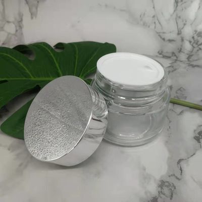 Tarro de la crema del vidrio del claro 100g de MSDS con el fango blanco de la máscara de la tapa del casquillo de plata brillante