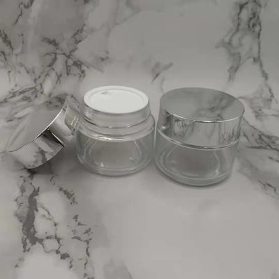 Tarro de la crema del vidrio del claro 100g de MSDS con el fango blanco de la máscara de la tapa del casquillo de plata brillante